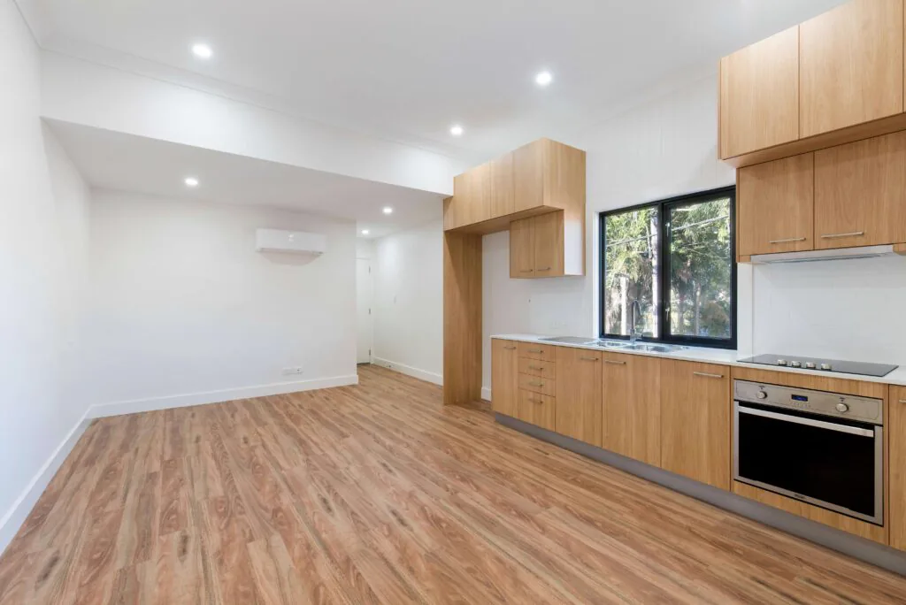 Warm timber flooring in a modern kitchen